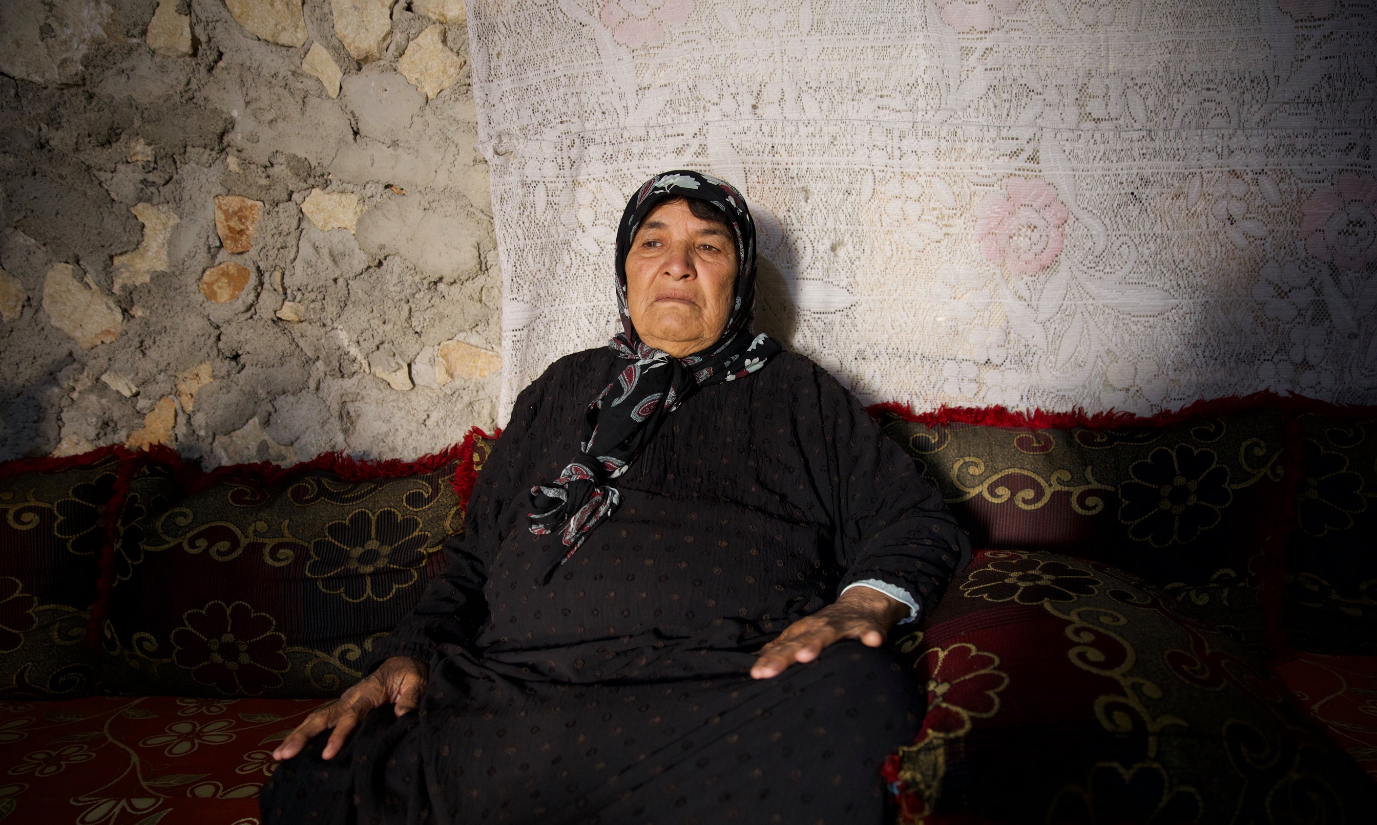 Asriya Awad, an 80-year-old Syrian, is living in one of the Sarmada camps, north of Idlib. It took her 10 days to cross back into Syria from Lebanon. Photograph: Ali Haj Suleiman/Guardian