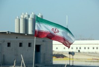 صورة لمحطة نووية وأمامها علم إيران - المصدر: الإنترنت