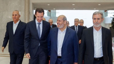 خليل الحية إلى جانب بشار الأسد