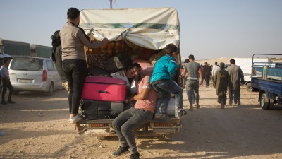 Syrian refugees who had been living in Lebanon arrive in an opposition-controlled area in north-western Syria via the Aoun al-Dadat crossing. Photograph: Ali Haj Suleiman/The Guardian